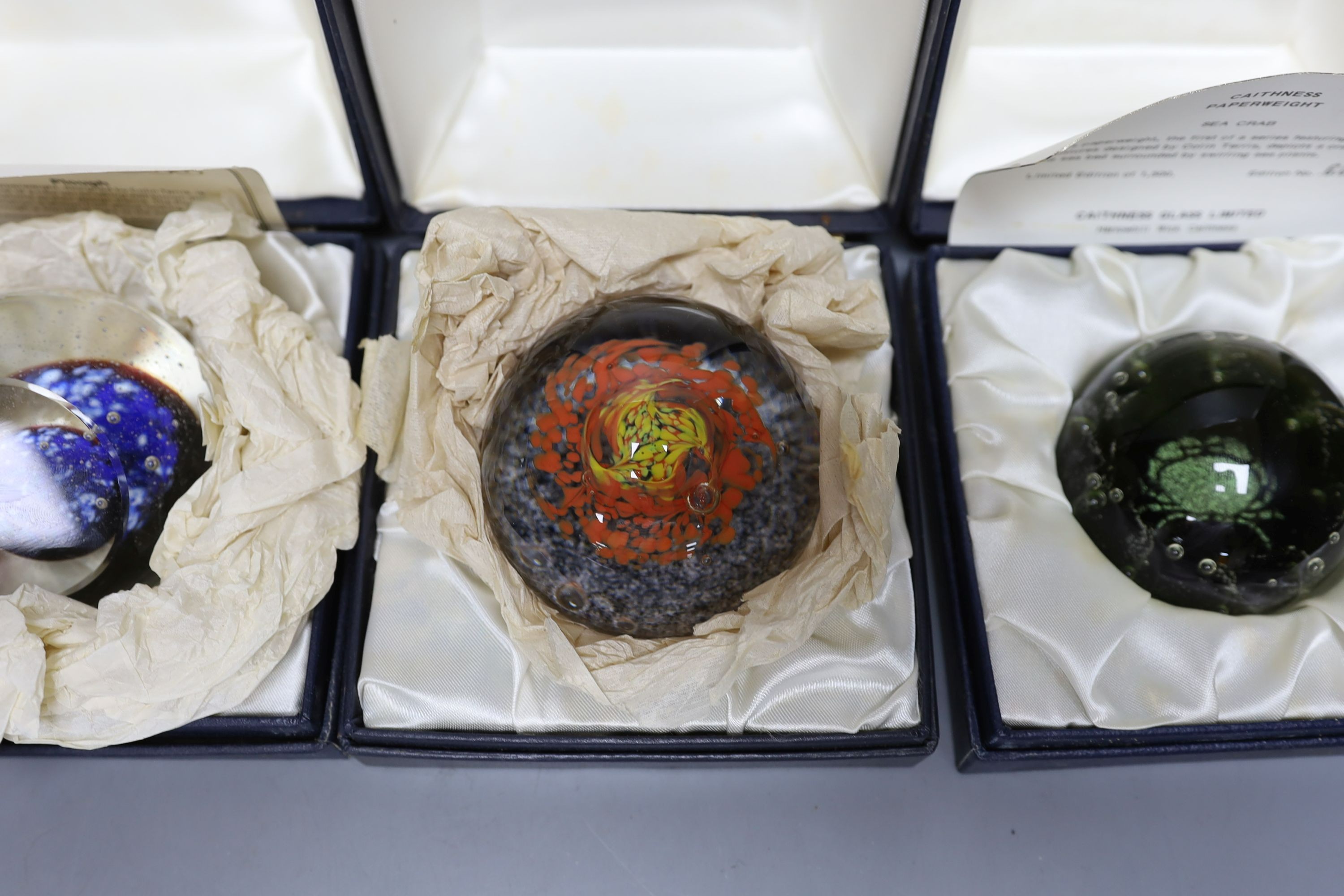 Four cased Caithness glass paperweights